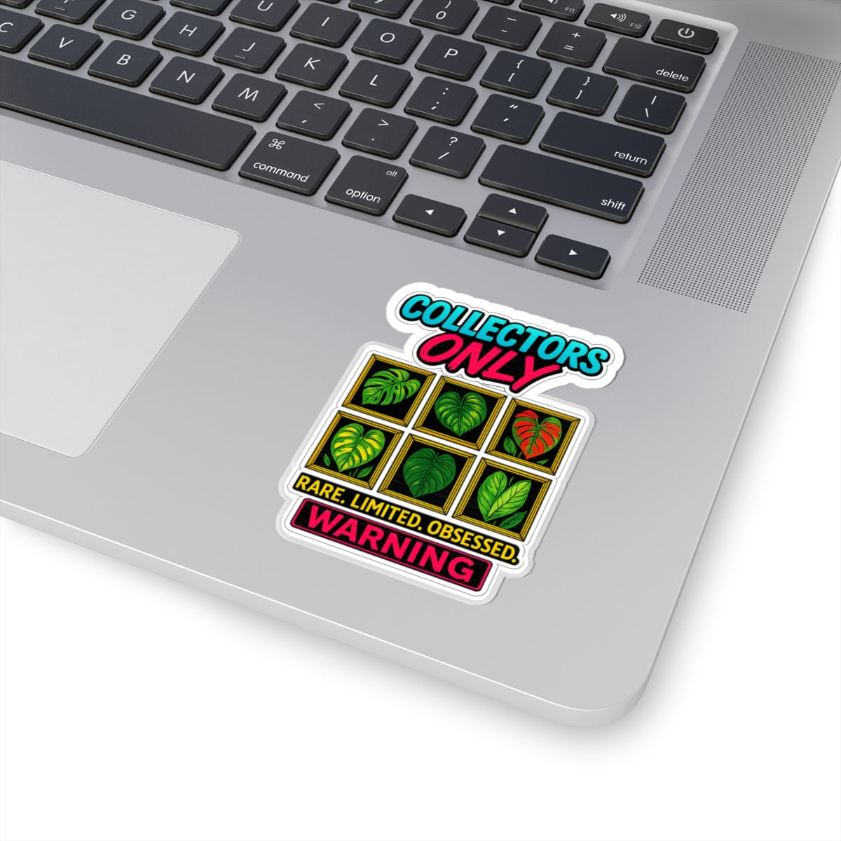 Laptop with a sticker on the palm rest area, featuring text and leaf graphics.