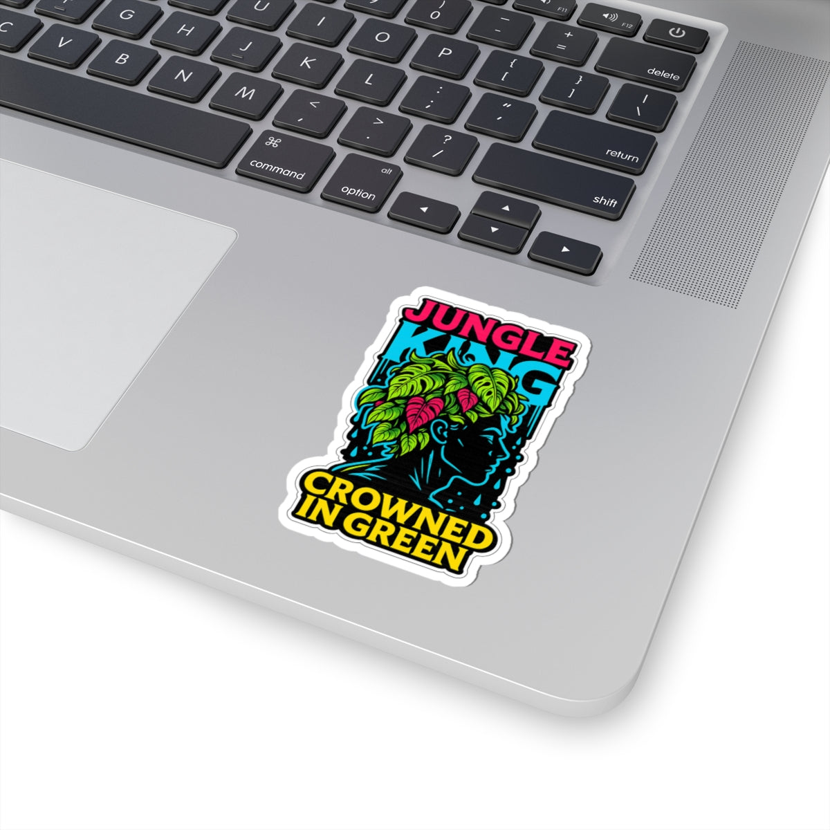 Sticker with 'Jungle King Crowned in Green' design on a laptop