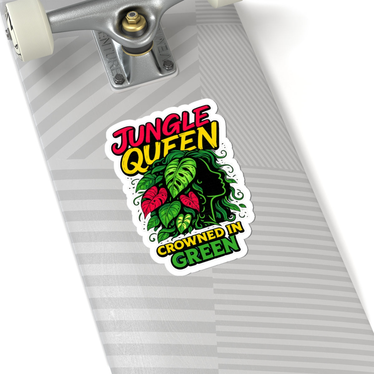 Skateboard with a 'Jungle Queen Crowned in Green' sticker on a white background