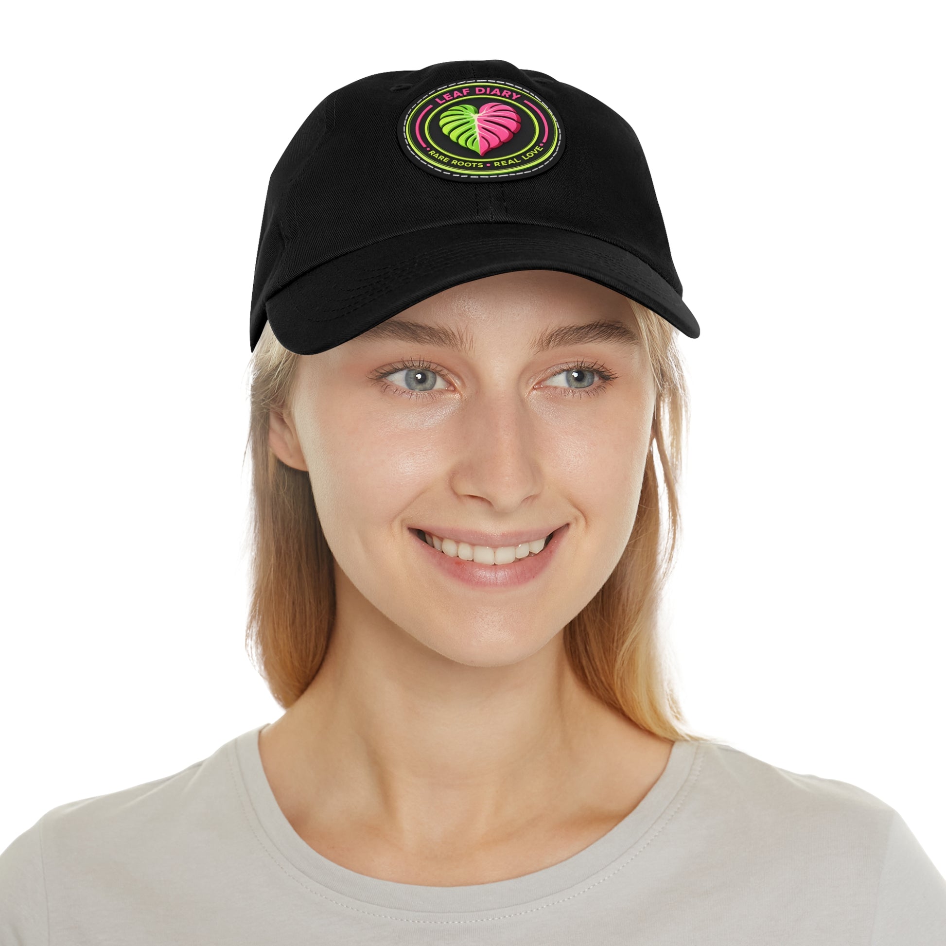Person wearing a black cap with a colorful logo on a white background